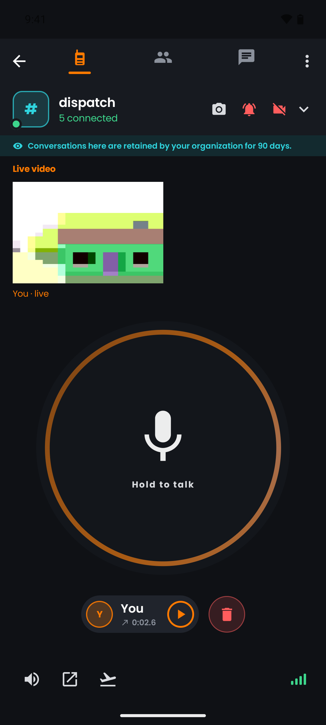 A live video broadcast from a push.tt channel, with the hold-to-talk control still available underneath